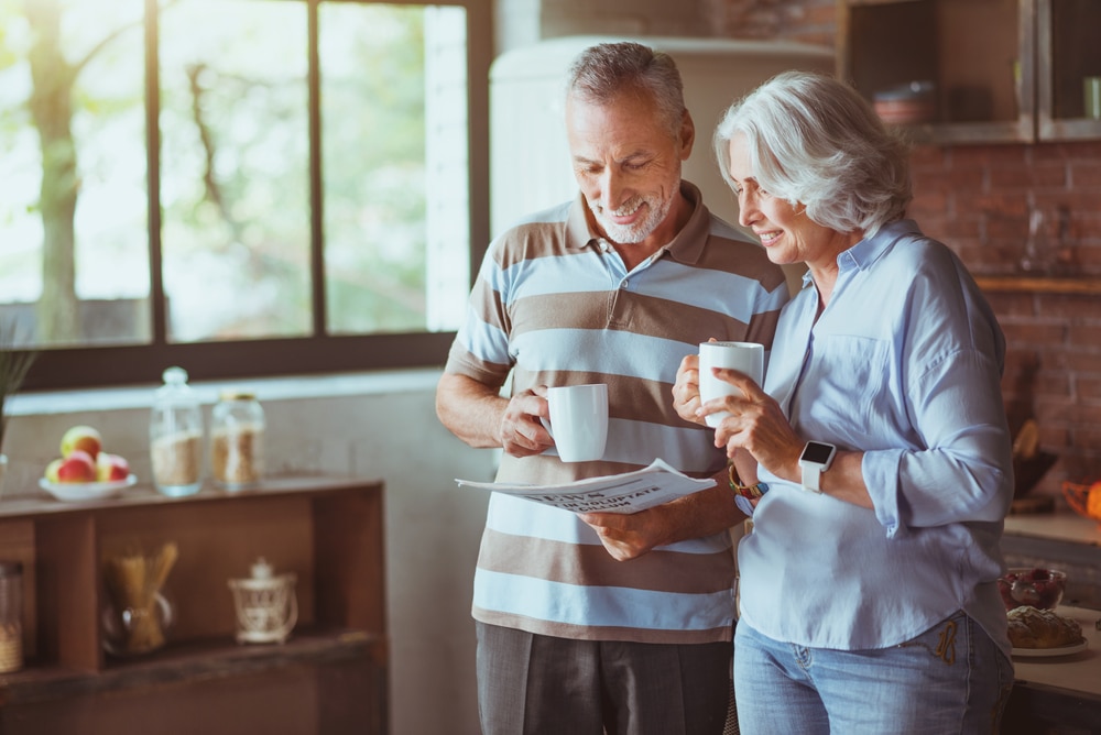 Couple enjoying a cup of coffee: Guest experiences are important to consider when buying a bed and breakfast, and something our Inn consulting can help with.