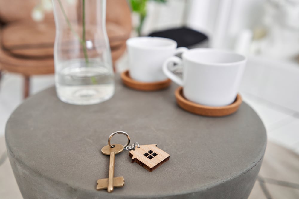 New keys and coffee cups on the table, as you close out the purchase of a Bed and Breakfast for sale